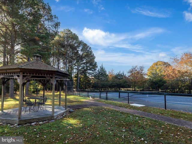 view of yard featuring a gazebo and tennis court