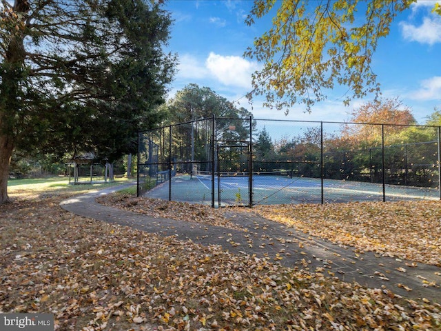 view of sport court featuring tennis court