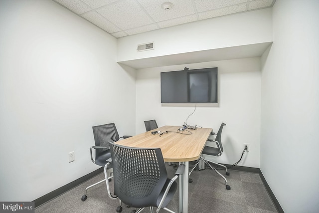 office with carpet flooring and a drop ceiling