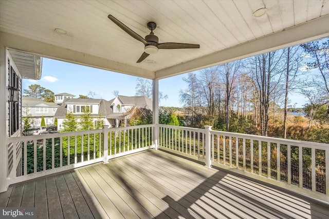 wooden deck featuring ceiling fan