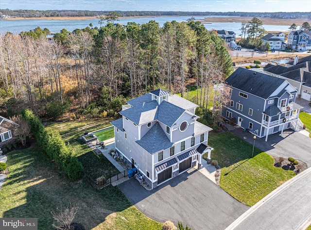 birds eye view of property with a water view