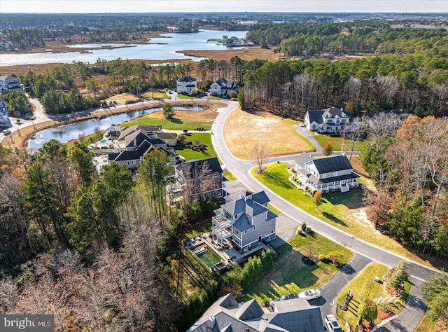 drone / aerial view with a water view