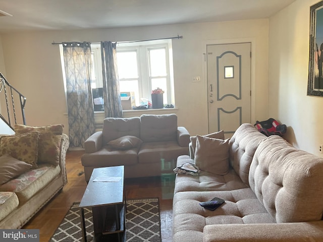 living room featuring dark wood-type flooring