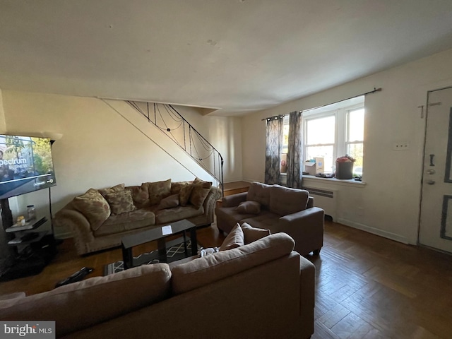 living room with radiator and parquet flooring