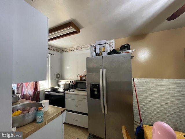 kitchen with white cabinets and stainless steel appliances