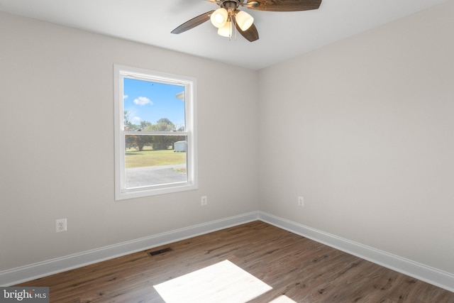 unfurnished room with hardwood / wood-style floors and ceiling fan