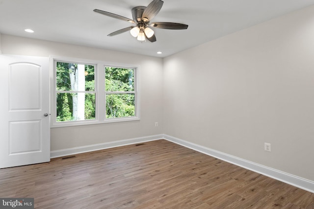 unfurnished room featuring hardwood / wood-style flooring and ceiling fan