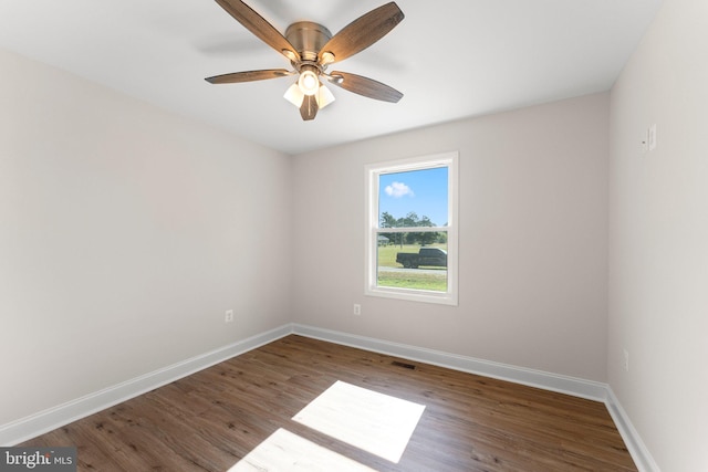 spare room featuring hardwood / wood-style flooring and ceiling fan