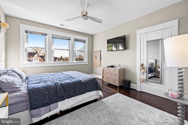 bedroom featuring dark hardwood / wood-style floors and ceiling fan