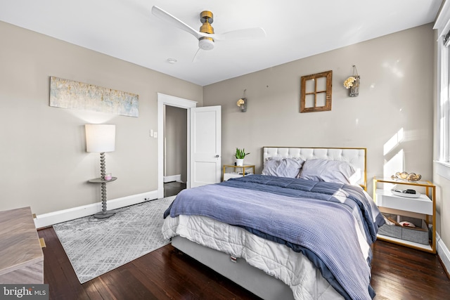 bedroom with ceiling fan and dark wood-type flooring