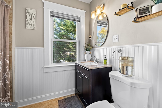 bathroom featuring toilet, vanity, and tile patterned floors