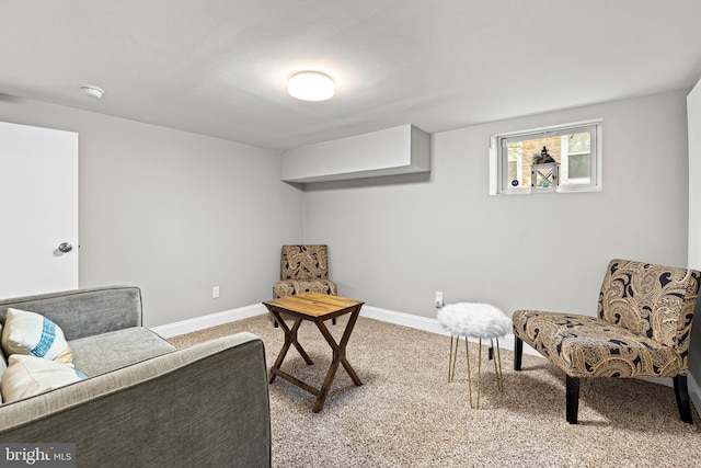 sitting room featuring light colored carpet