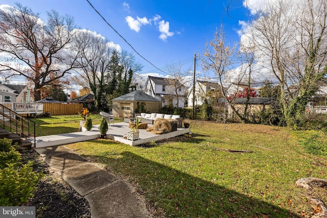 view of yard featuring a wooden deck and an outdoor living space