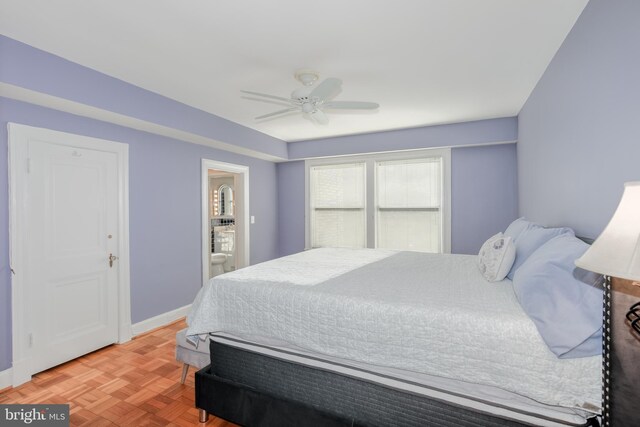 bedroom featuring ceiling fan and parquet floors
