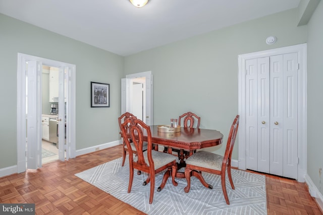 dining room with light parquet floors