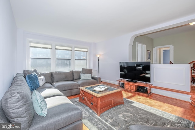 living room featuring parquet flooring