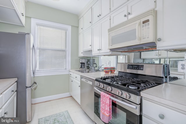 kitchen featuring white cabinetry, sink, and appliances with stainless steel finishes
