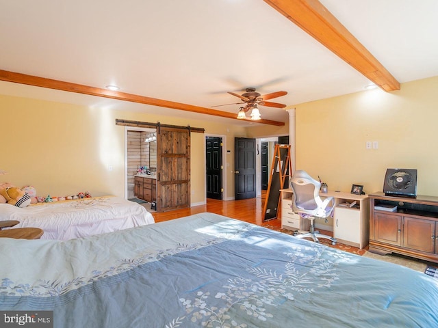 bedroom featuring beamed ceiling, ceiling fan, a barn door, and light hardwood / wood-style floors