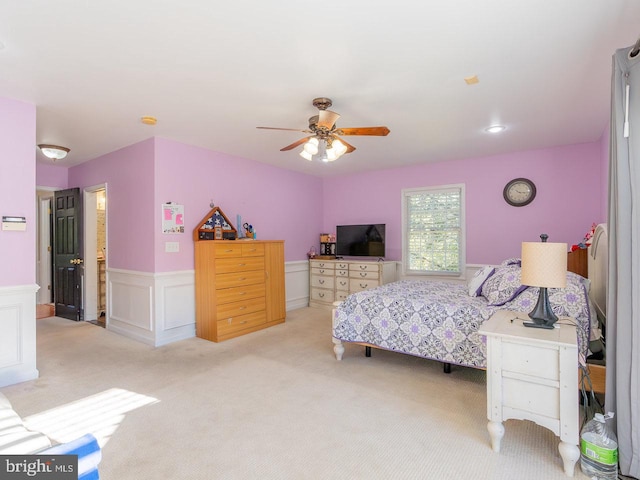 bedroom with ceiling fan and light colored carpet