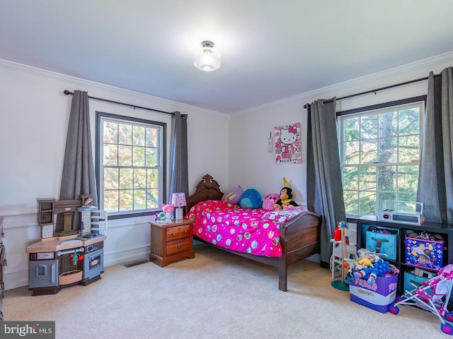 bedroom with crown molding and light colored carpet