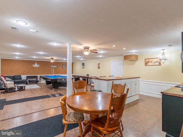 playroom featuring light hardwood / wood-style flooring, billiards, crown molding, a textured ceiling, and ceiling fan with notable chandelier