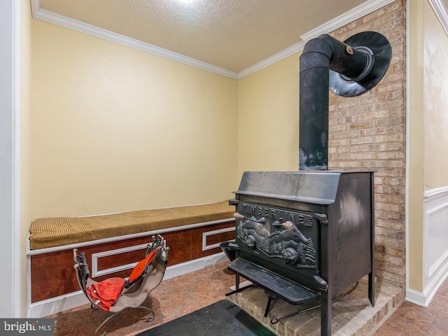 room details with a textured ceiling, a wood stove, and crown molding