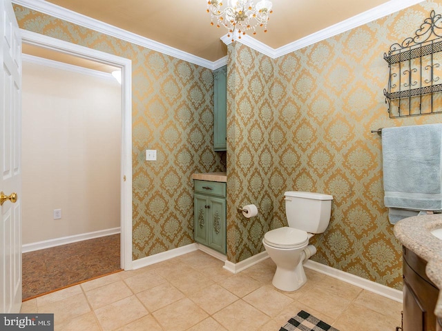 bathroom featuring vanity, crown molding, tile patterned flooring, toilet, and a notable chandelier