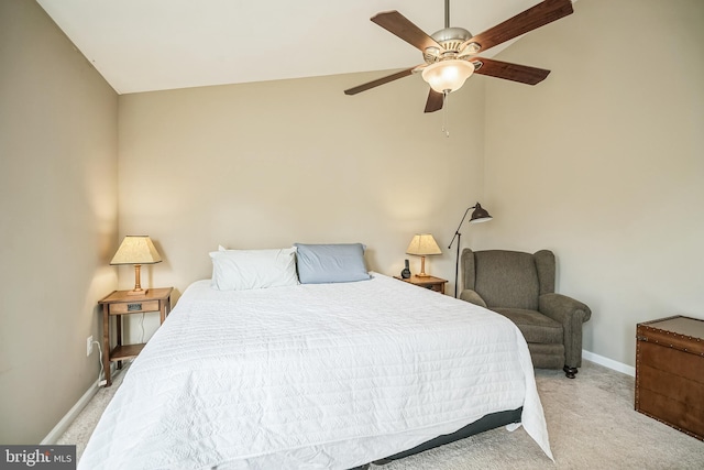 carpeted bedroom featuring ceiling fan and vaulted ceiling