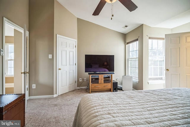 carpeted bedroom featuring lofted ceiling and ceiling fan