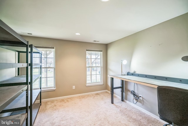 unfurnished office with light colored carpet and a healthy amount of sunlight