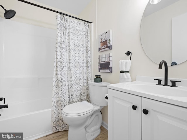 full bathroom featuring shower / bath combination with curtain, vanity, hardwood / wood-style flooring, and toilet