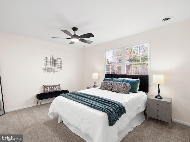 bedroom featuring ceiling fan and light colored carpet