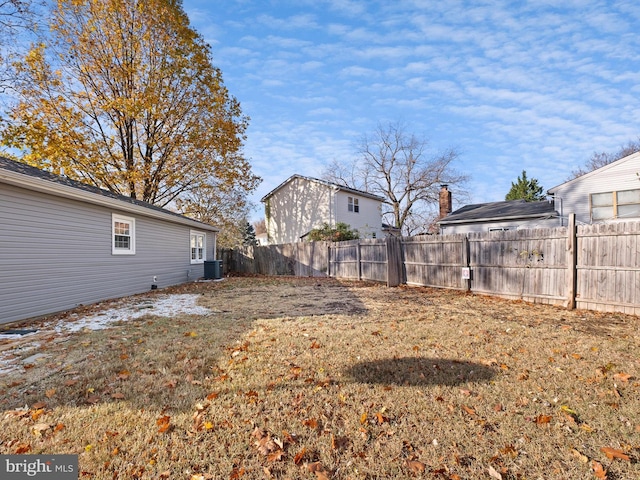 view of yard with central AC unit