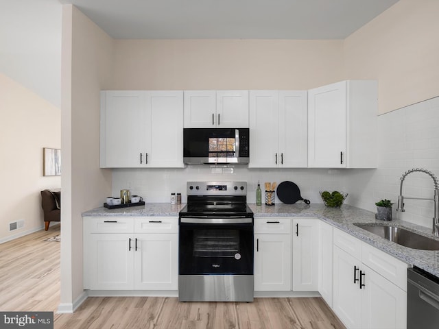 kitchen featuring white cabinets and stainless steel appliances