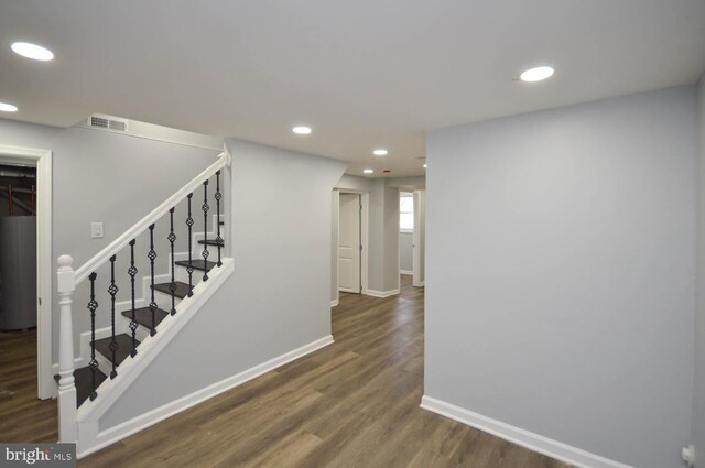 staircase with wood-type flooring