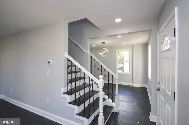 foyer entrance with dark wood-type flooring