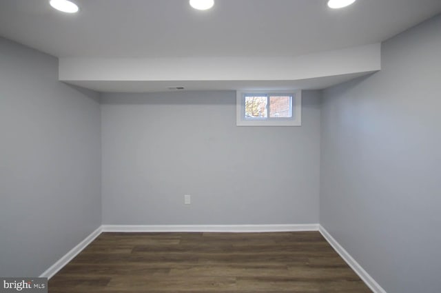 basement with dark wood-type flooring