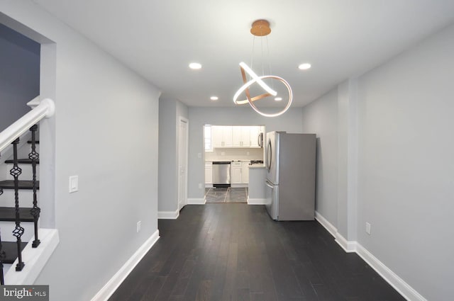 hall with dark hardwood / wood-style flooring