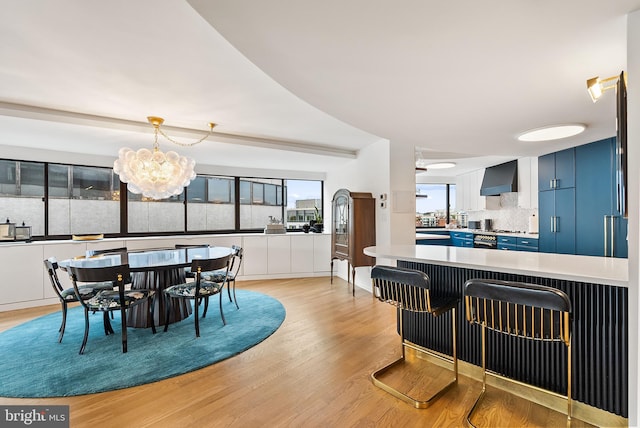 2510 Virginia Ave NW Unit 1104-N, Washington, DC 20037 - dining area featuring light wood-style floors and a chandelier