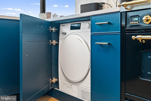 2510 Virginia Ave NW Unit 1104-N, Washington, DC 20037 - laundry view of washer / clothes dryer and black oven
