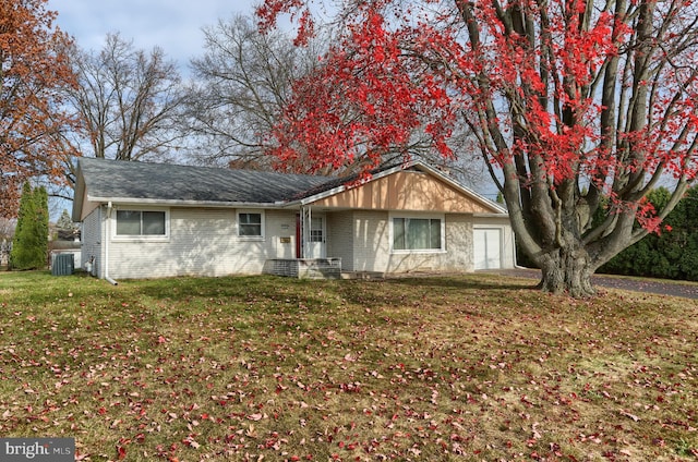 ranch-style home with a front lawn and cooling unit