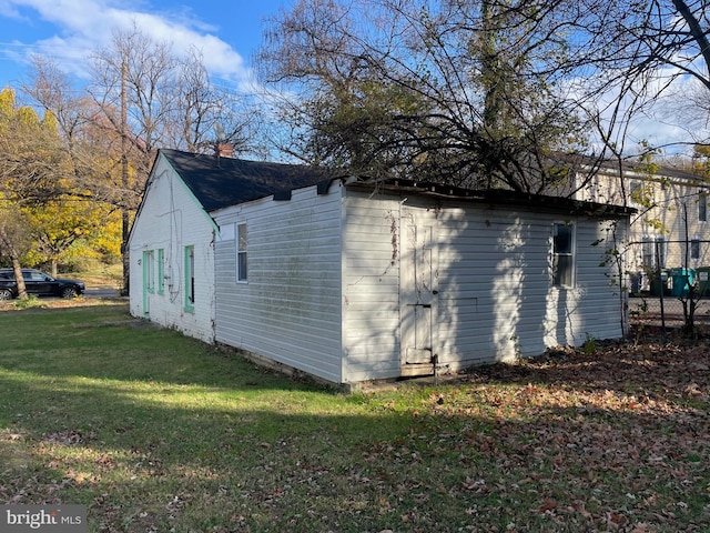 view of property exterior featuring a lawn