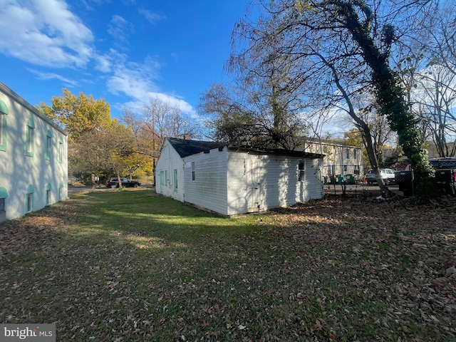 view of home's exterior with a lawn