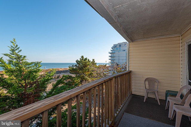 balcony featuring a water view