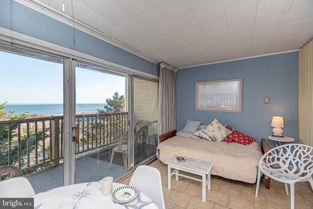 bedroom with a water view, crown molding, and access to outside