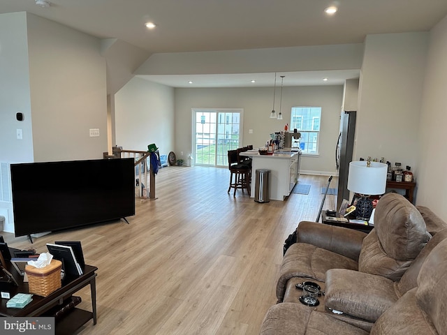 living room with light hardwood / wood-style flooring