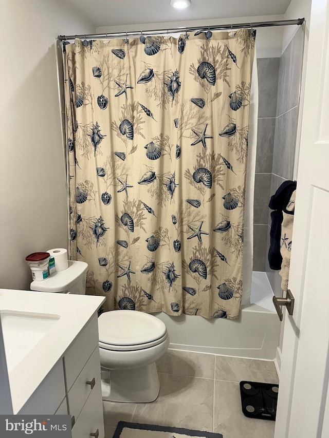 full bathroom featuring tile patterned floors, vanity, toilet, and shower / tub combo with curtain