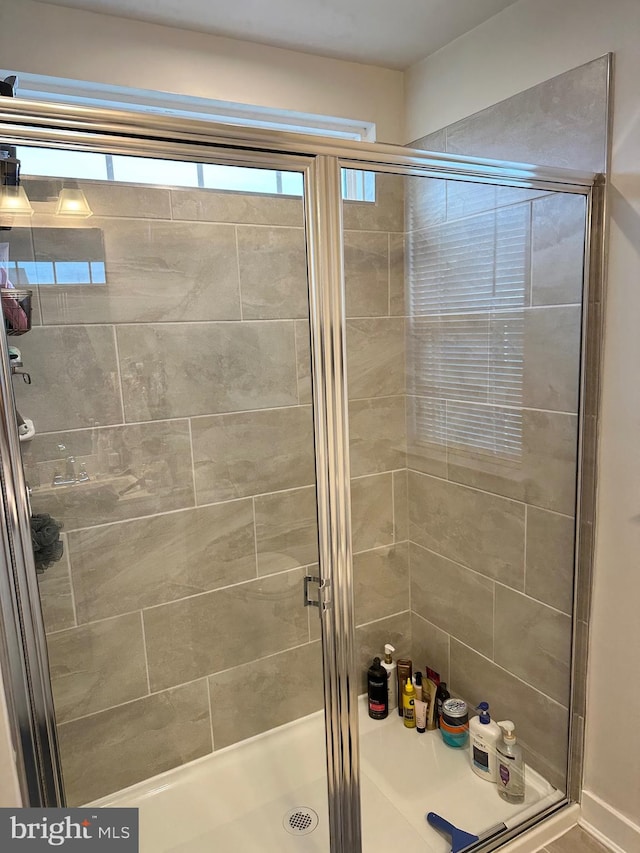 bathroom featuring an enclosed shower