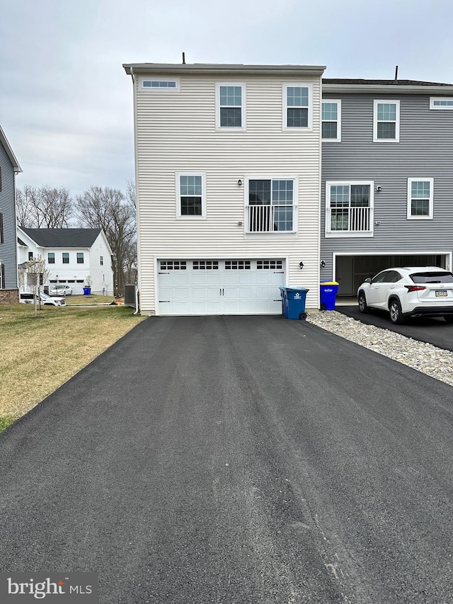 back of house with a garage