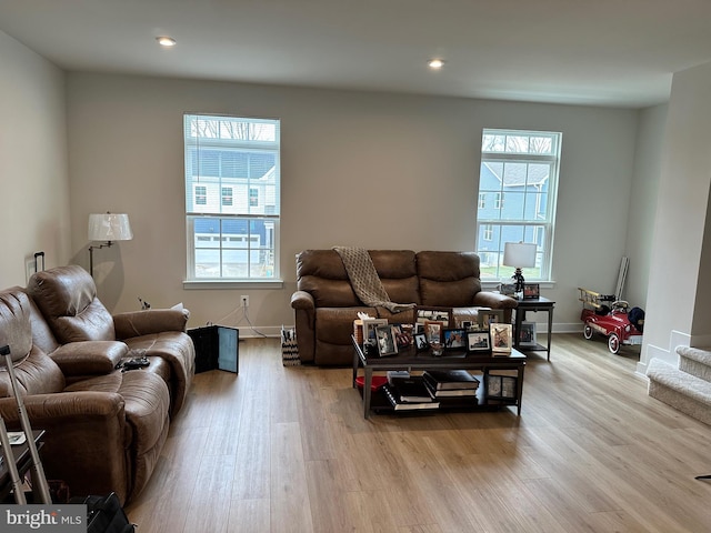 living room featuring light hardwood / wood-style flooring and plenty of natural light